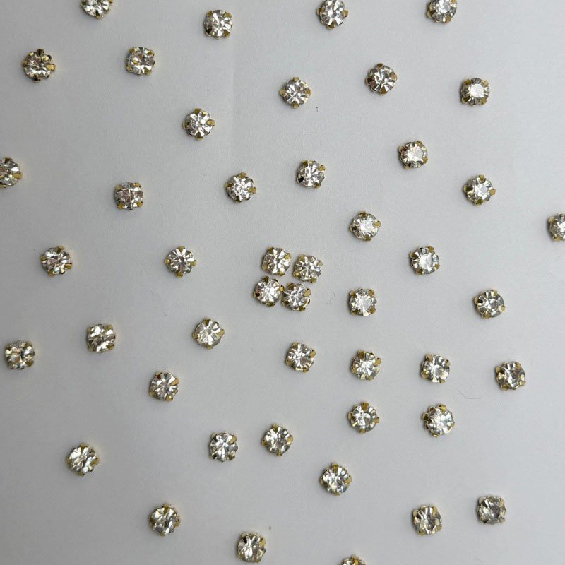 White Round Crystal with Gold Claw Setting